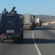 The Operational Support Service Unit of the Royal Eswatini Police escorts the rhinos to their destination.